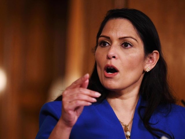 Britain's Home Secretary Priti Patel attends a COVID-19 pandemic virtual press conference inside 10 Downing Street in central London on January 12, 2021. - People who flout coronavirus lockdown rules were on Tuesday warned that police will take action, as the government vowed to step up enforcement measures to cut …