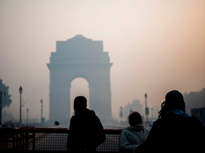 People gather in front of India Gate amid smoggy conditions in New Delhi on January 14, 20