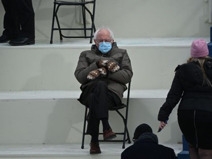 TOPSHOT - Former presidential candidate, Senator Bernie Sanders (D-Vermont) sits in the bleachers on Capitol Hill before Joe Biden is sworn in as the 46th US President on January 20, 2021, at the US Capitol in Washington, DC. (Photo by Brendan SMIALOWSKI / AFP) (Photo by BRENDAN SMIALOWSKI/AFP via Getty …