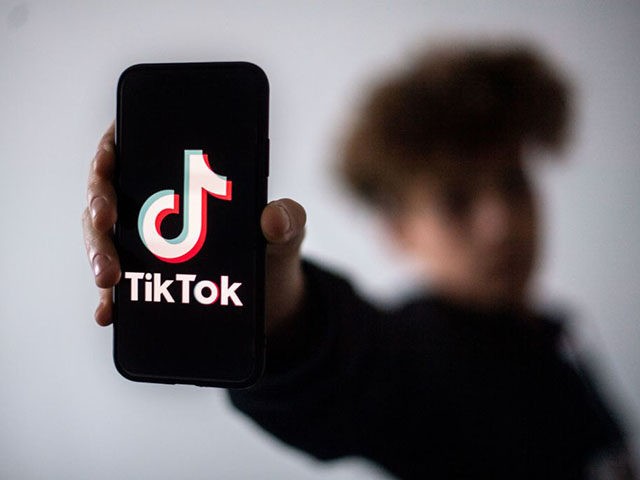 A teenager presents a smartphone with the logo of Chinese social network Tik Tok, on January 21, 2021 in Nantes, western France. (Photo by LOIC VENANCE / AFP) (Photo by LOIC VENANCE/AFP via Getty Images)