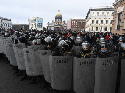 Law enforcement officers block protesters during a rally in support of jailed opposition leader Alexei Navalny in Saint Petersburg on January 31, 2021. - Navalny, 44, was detained on January 17 upon returning to Moscow after five months in Germany recovering from a near-fatal poisoning with a nerve agent and …