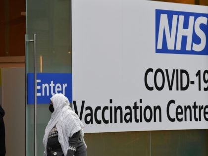 People enter an NHS Covid-19 vaccination centre in Westfield Stratford City shopping centre in east London on February 6, 2021 as Britain's largest ever vaccination programme continues. - More than 10 million people have received a first dose of a Covid-19 vaccine in Britain, according to government statistics published on …