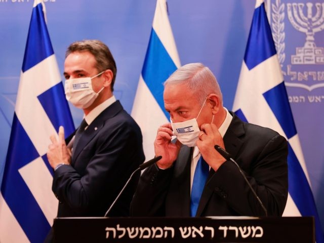 Israeli Prime Minister Benjamin Netanyahu and the Greek Prime Minister Kyriakos Mitsotakis prepare for a press conference after their meeting in the Prime Minister's office in Jerusalem on February 8, 2021. (Photo by menahem kahana / POOL / AFP) (Photo by MENAHEM KAHANA/POOL/AFP via Getty Images)