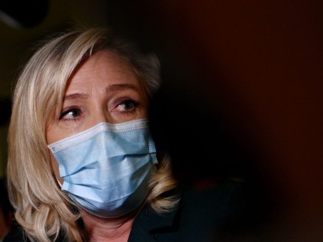Head of far-right party Rassemblement National (RN) Marine Le Pen answers the press as she