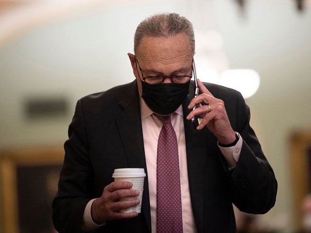 Senate Majority Leader Charles E. Schumer (D-NY) talks on the phone after the third day of former US President Donald Trump's second impeachment trial before the Senate on Capitol Hill February 11, 2021, in Washington, DC. - Democrats rested their impeachment case against Donald Trump on February 11, saying he …