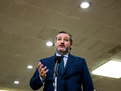 WASHINGTON, DC - FEBRUARY 13: Senator Ted Cruz (R-TX) talks to reporters in the Senate subway during a break in the fifth day of the Senates second impeachment trial of former President Donald Trump on February 13, 2021 in Washington, DC. The Senate voted 55-45 Saturday to accept testimony from …