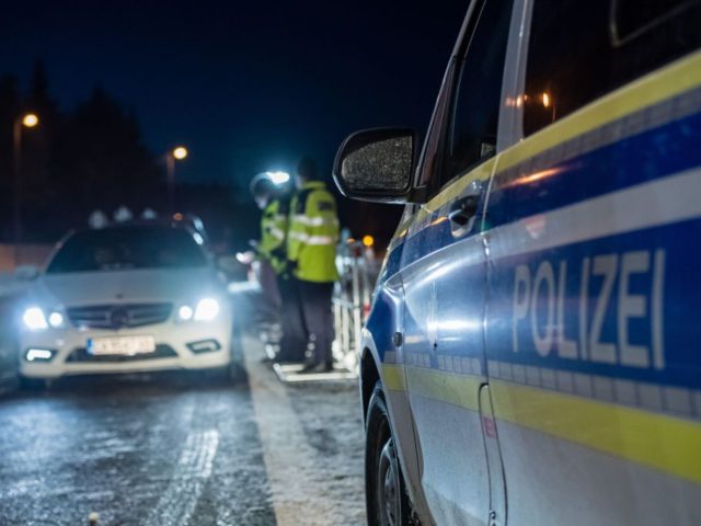 Officers of the Federal Police control a car driver at the German-Czech border near Marienberg district Reitzenhain, eastern Germany, on February 14, 2021. - Germany implemented more measures to keep coronavirus variants at bay, banning travel from Czech border regions and Austria's Tyrol after a troubling surge in contagious mutations. …