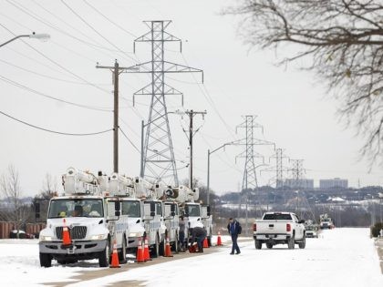 FORT WORTH, TX - FEBRUARY 16: Pike Electric service trucks line up after a snow storm on February 16, 2021 in Fort Worth, Texas. Winter storm Uri has brought historic cold weather and power outages to Texas as storms have swept across 26 states with a mix of freezing temperatures …