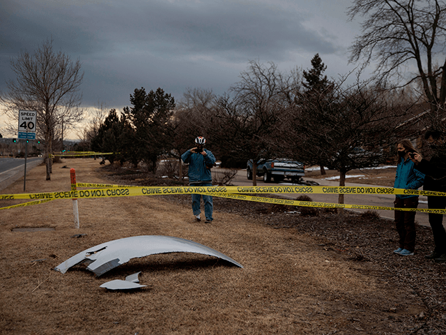Residents take pictures of debris fallen from a United Airlines airplane's engine on the neighborhood of Broomfield, outside Denver, Colorado, on February 20, 2021 - A United Airlines flight suffered a fiery engine failure February 20, shortly after taking off from Denver on its way to Hawaii, dropping massive debris …