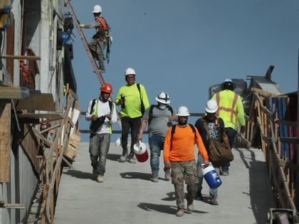 MIAMI, FLORIDA - SEPTEMBER 04: Construction workers are seen on a job site on September 04