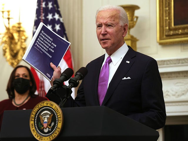 WASHINGTON, DC - JANUARY 21: U.S. President Joe Biden speaks as Vice President Kamala Harr