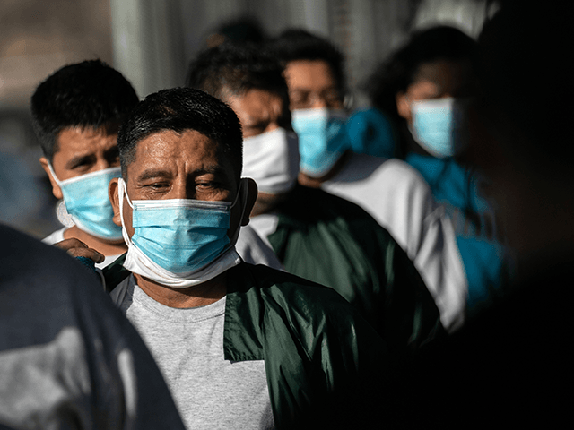 Mexican deportees walk across the Gateway International Bridge into Mexico after being deported by U.S. immigration authorities on February 24, 2021 in Matamoros, Mexico. The group said that they had been flown to Brownsville, Texas on the U.S.-Mexico border from a detention facility in Miami. One man from Guadalajara, Mexico …