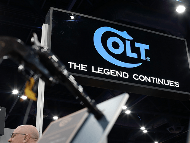 A sign is displayed in the Colt booth during the 2013 NRA Annual Meeting and Exhibits at t