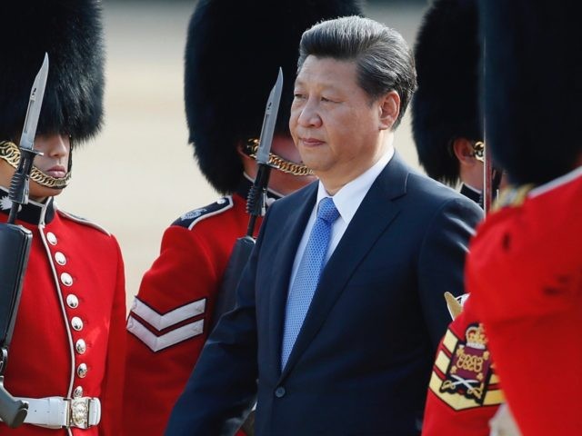 Chinese President Xi Jinping is escorted as he inspects a guard of honour during the official welcome ceremony at Horse Guards Parade in London, Tuesday, Oct. 20, 2015. Chinese President Xi Jinping arrived in Britain Monday for a four-day state visit as part of a push to increase trade ties …