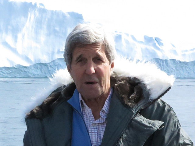 US Secretary of State John Kerry (R) Danish Minister for Foreign Affairs Kristian Jensen (L) and Greenland Premier Kim Kielsen pose during a tour to the Jakobshavn Glacier and the Ilulissat Icefjord, located 155 miles (250 km) north of the Arctic Circle, June 17, 2016, in Ilulissat, Greenland. (Photo by …