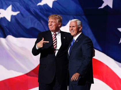 CLEVELAND, OH - JULY 20: Republican presidential candidate Donald Trump stand with Republican vice presidential candidate Mike Pence and acknowledge the crowd on the third day of the Republican National Convention on July 20, 2016 at the Quicken Loans Arena in Cleveland, Ohio. Republican presidential candidate Donald Trump received the …