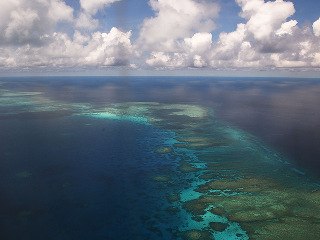 This photo taken on April 21, 2017 shows an aerial shot of part of mischief reef in the disputed Spratly islands on April 21, 2017. Philippine Defence Secretary Delfin Lorenzana flew to a disputed South China Sea island on April 21, brushing off a challenge by the Chinese military while asserting Manila's territorial claim to the strategic region. / AFP PHOTO / TED ALJIBE (Photo credit should read TED ALJIBE/AFP via Getty Images)