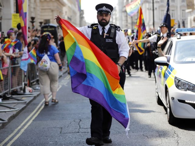 Police officers join supporters and members of the Lesbian, Gay, Bisexual and Transgender