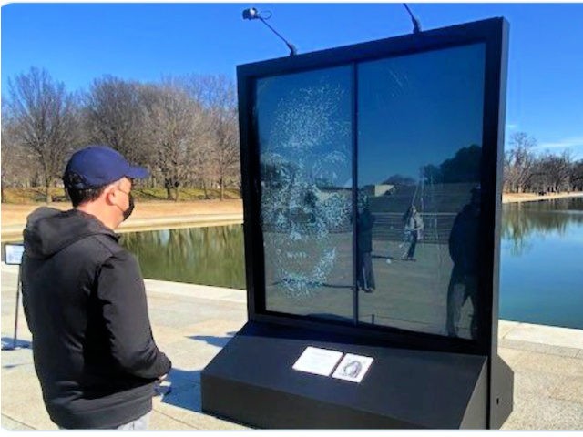 Harris's Husband Views Shattered Glass Portrait