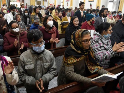 Christian devotees offer prayers on Christmas at a church in Amritsar on December 25, 2020
