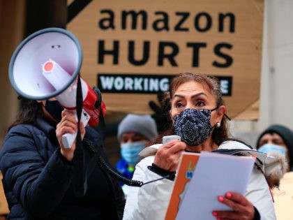 Alma Delia Garcia of New York Communities for Change speaks during a protest organized by New York Communities for Change and Make the Road New York in front of the Jeff Bezos' Manhattan residence in New York on December 02, 2020. (Photo by Kena Betancur / AFP) (Photo by KENA …