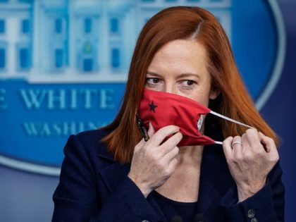 WASHINGTON, DC - JANUARY 29: White House Press Secretary Jen Psaki removes her face covering as she arrives for the daily press briefing at the White House on January 29, 2021 in Washington, DC. On Friday afternoon, President Joe Biden will travel to Walter Reed National Military Medical Center to …