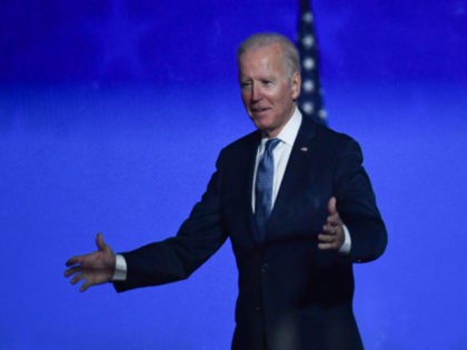 Democratic presidential nominee Joe Biden greets supporters after speaking during election night at the Chase Center in Wilmington, Delaware, early on November 4, 2020. - Democrat Joe Biden said early Wednesday he believes he is "on track" to defeating US President Donald Trump, and called for Americans to have patience …