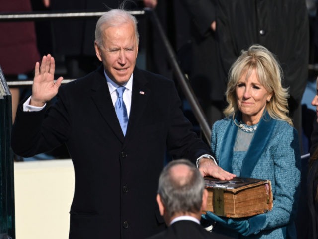 Joe Biden is sworn in as the 46th president of the United States by Chief Justice John Roberts as Jill Biden holds the Bible during the 59th Presidential Inauguration at the U.S. Capitol in Washington, Wednesday, Jan. 20, 2021. (AP Photo/Andrew Harnik)