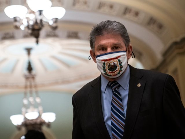 WASHINGTON, DC - FEBRUARY 11: Sen. Joe Manchin (D-WV) walks to the Senate Chamber on the third day of former President Donald Trump's second impeachment trial at the U.S. Capitol on February 11, 2021 in Washington, DC. House impeachment managers will make the case that Trump was singularly responsible for …