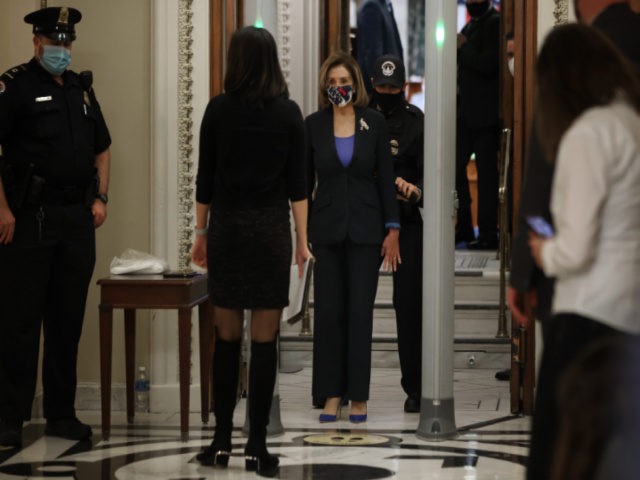 Speaker of the House Nancy Pelosi (D-CA) cooperates with U.S. Capitol Police as she screened at a metal detector at the doors of the House of Representatives Chamber during a series of votes on January 12, 2021 in Washington, DC. Today the House of Representatives plans to vote on Rep. …