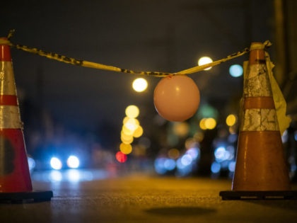 A makeshift temporary barrier created by activists is placed in the street near the 18th Precinct Police Department during a citywide curfew n October 28, 2020 in Philadelphia, Pennsylvania. With calls to defund the police, homicides increased by 30 percent in January 2021 in Philadelphia. (Photo by Mark Makela/Getty Images)