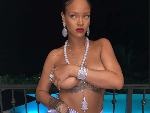 Music superstar Rihanna is facing backlash after posing with a pendant depicting the Hindu god Ganesha in a topless Instagram photo on Monday.