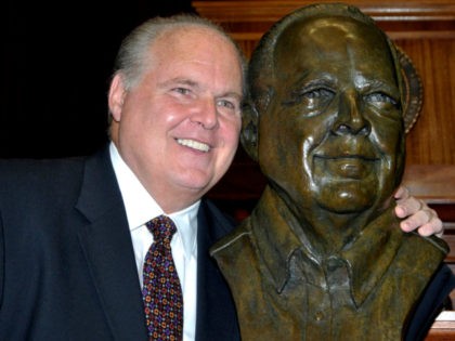 In this May 14, 2012 file photo, conservative commentator Rush Limbaugh poses with a bust