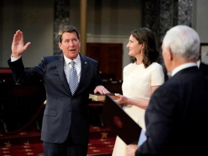 WASHINGTON, DC - JANUARY 3: Sen. Bill Hagerty (R-TN) joined by his wife Chrissy Hagerty, takes the oath of office from Vice President Mike Pence during a mock swearing-in ceremony in the Old Senate Chamber at the Capitol on January 3, 2021 in Washington, DC. Both chambers are holding rare …
