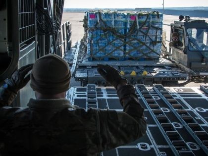Texas Air National Guardsmen from the 181st Airlift Squadron load pallets of water on a C-130H Hercules February 19, 2021, at Naval Air Station Joint Reserve Base Fort Worth, Texas. Several aircraft delivered much needed bottled water to towns in South Texas after the devastating North America Winter Storm. (Texas …