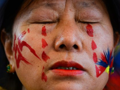 A Tibetan woman living in exile reacts during an event to mark the 61st anniversary of the Tibetan Uprising Day that commemorates the 1959 Tibetan uprising, in McLeod Ganj on March 10, 2020. (Photo by Sajjad HUSSAIN / AFP) (Photo by SAJJAD HUSSAIN/AFP via Getty Images)