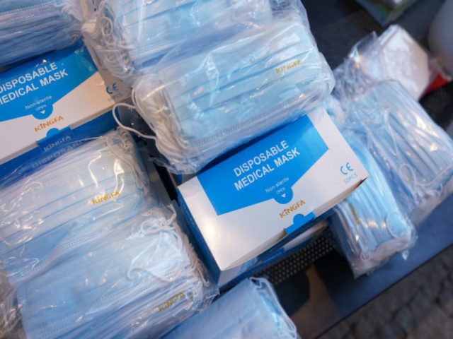 Medical face masks lie in boxes during distribution by city workers at the Berlin Mitte district administrative building during the second wave of the coronavirus pandemic on January 26, 2021 in Berlin, Germany. Elderly, disabled and other needy groups are allowed to collect five free face masks per week at …