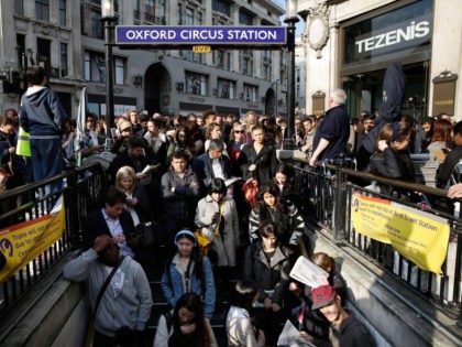 LONDON, ENGLAND - APRIL 29: Commuters are held outside Oxford Circus tube station to avoid overcrowding on April 29, 2014 in London, England. Union members are striking for 48 hours in a dispute over management plans to close all ticket offices with a loss of nearly 1000 jobs. (Photo by …