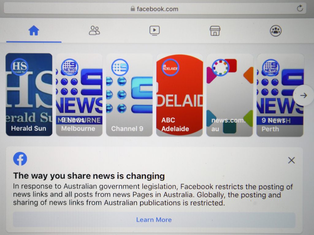 In this photo illustration various news sites are seen on Facebook on February 18, 2021 in Melbourne, Australia. Facebook has banned publishers and users in Australia from posting and sharing news content as the Australian government prepares to pass laws that will require social media companies to pay news publishers for sharing or using content on their platforms. (Photo by Robert Cianflone/Getty Images)