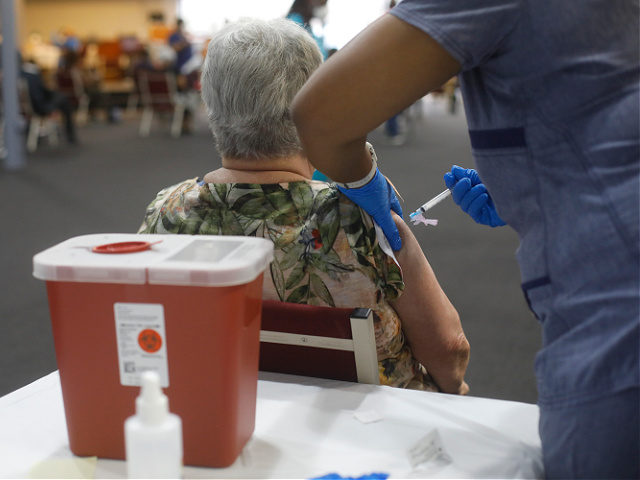 TAMPA, FL - FEBRUARY 13: Bible-Based Fellowship Church partnered with the Pasco County Health Department, and Army National Guard to assist residents who are 65 and older to administer the Moderna Covid-19 vaccine on February 13, 2021 in Tampa, Florida. Pastor Anthony White of Bible-Based Fellowship Church encourages more people …