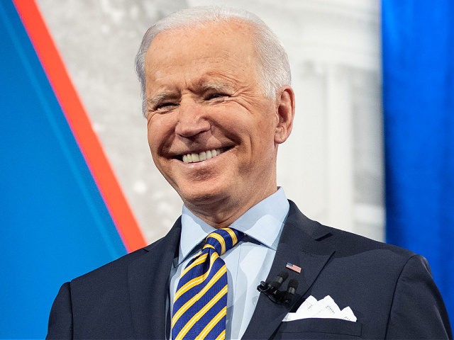 US President Joe Biden holds a face mask as he participates in a CNN town hall at the Pabst Theater in Milwaukee, Wisconsin, February 16, 2021. (Photo by SAUL LOEB / AFP) (Photo by SAUL LOEB/AFP via Getty Images)