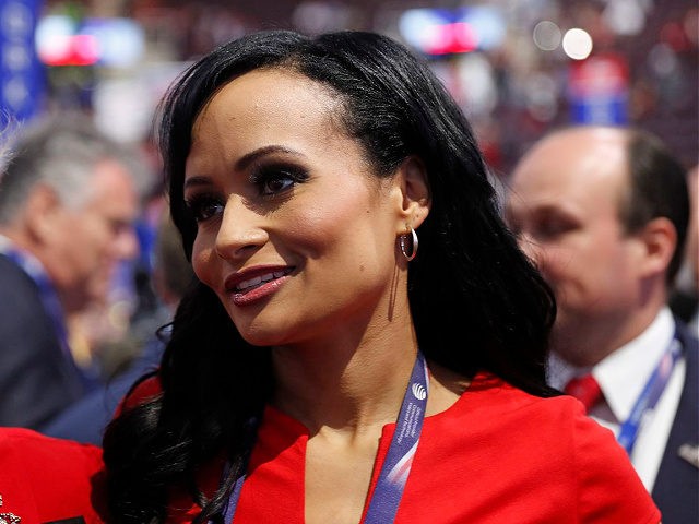 Republican Presidential Candidate Donald Trump spokeswoman Katrina Pierson, right, talks with delegates on the convention floor during the final day of the Republican National Convention in Cleveland, Thursday, July 21, 2016. (AP Photo/Carolyn Kaster)