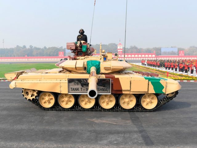 Army soldiers in a T-90 tank march past during a ceremony to celebrate India's 73rd Army Day in New Delhi on January 15, 2021. (Photo by Prakash SINGH / AFP) (Photo by PRAKASH SINGH/AFP via Getty Images)