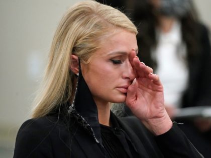 Paris Hilton wipes her eyes after speaking at a committee hearing at the Utah State Capitol, Monday, Feb. 8, 2021, in Salt Lake City. Hilton has been speaking out about abuse she says she suffered at a boarding school in Utah in the 1990s and she testified in front of …