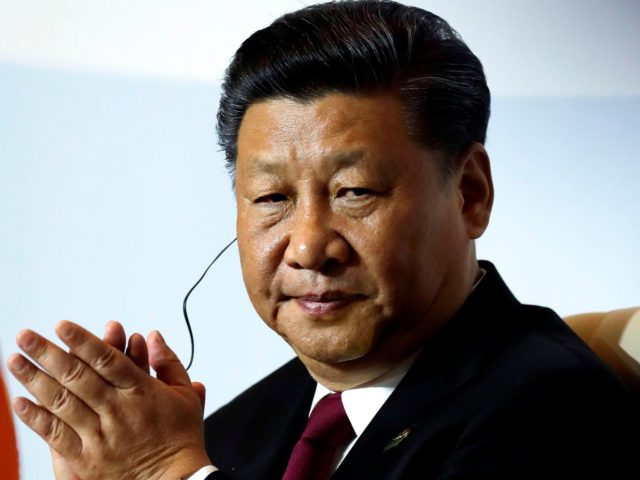 Chinese President Xi Jinping applauds during the 10th BRICS summit (acronym for the grouping of the world's leading emerging economies, namely Brazil, Russia, India, China and South Africa) on July 26, 2018 at the Sandton Convention Centre in Johannesburg, South Africa. (Photo by Themba Hadebe / POOL / AFP) (Photo …