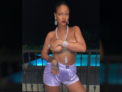 Music superstar Rihanna is facing backlash after posing with a pendant depicting the Hindu god Ganesha in a topless Instagram photo on Monday.