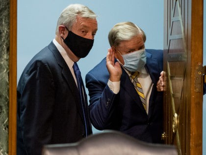 WASHINGTON, DC - JUNE 09: Chairman Sen. Lindsey Graham (R-SC), right, speaks with Sen. Richard Durbin (D-IL) left, as they arrive for a Senate Judiciary Committee hearing to examine COVID-19 fraud, focusing on law enforcement's response to those exploiting the pandemic, on Capitol Hill on June 9, 2020 in Washington, …