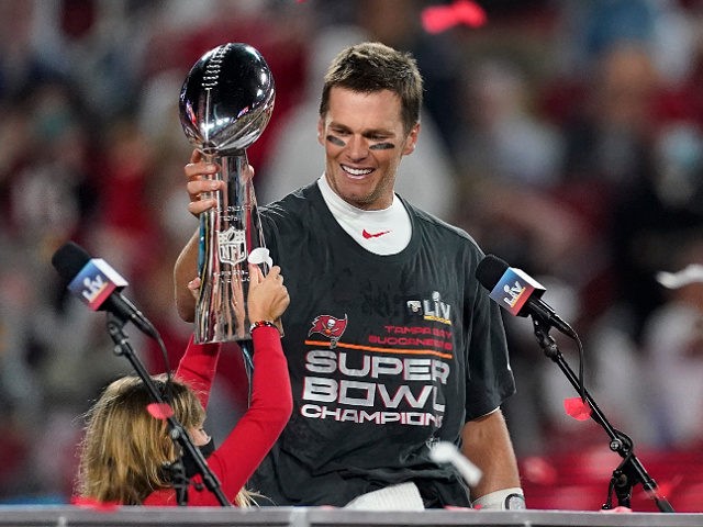 Tampa Bay Buccaneers quarterback Tom Brady holds up the Vince Lombardi trophy after defeat