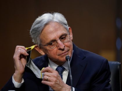 Judge Merrick Garland removes his facemask as he testifies before a Senate Judiciary Committee hearing on his nomination to be US Attorney General on Capitol Hill in Washington, DC on February 22, 2021. (Photo by Drew Angerer / POOL / AFP) (Photo by DREW ANGERER/POOL/AFP via Getty Images)