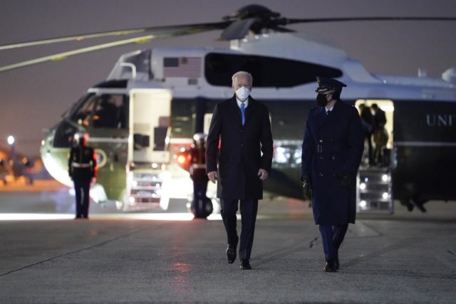 President Joe Biden walks to board Air Force One for a trip to Camp David Friday Feb. 12 2021 in Andrews Air Force Base Md
